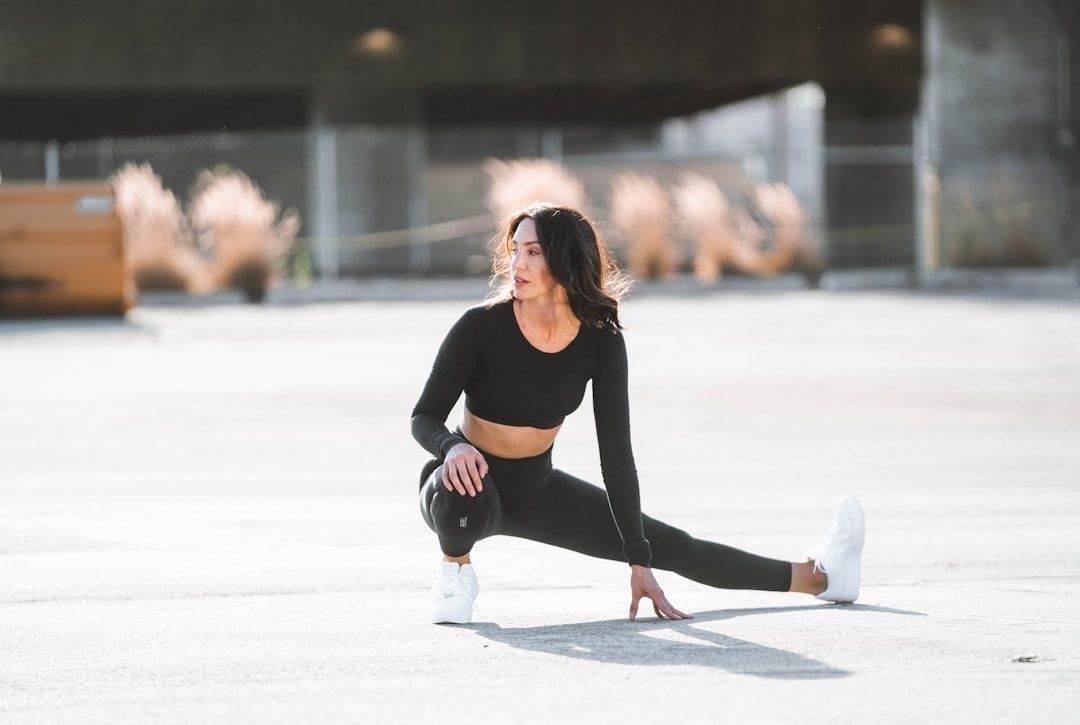 Woman performing a deep lateral lunge stretch for hip mobility